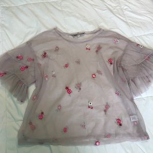 Sheer top with ruffled sleeves and tank top